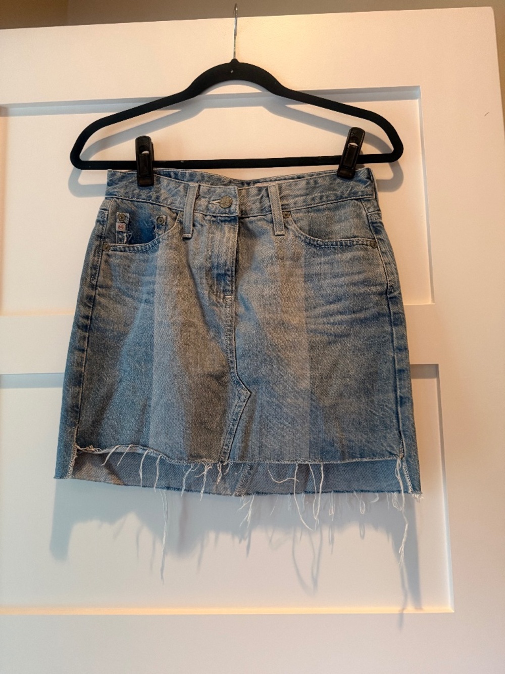 AG Denim Mini Skirt with Bi Level Cut and Distressed Details